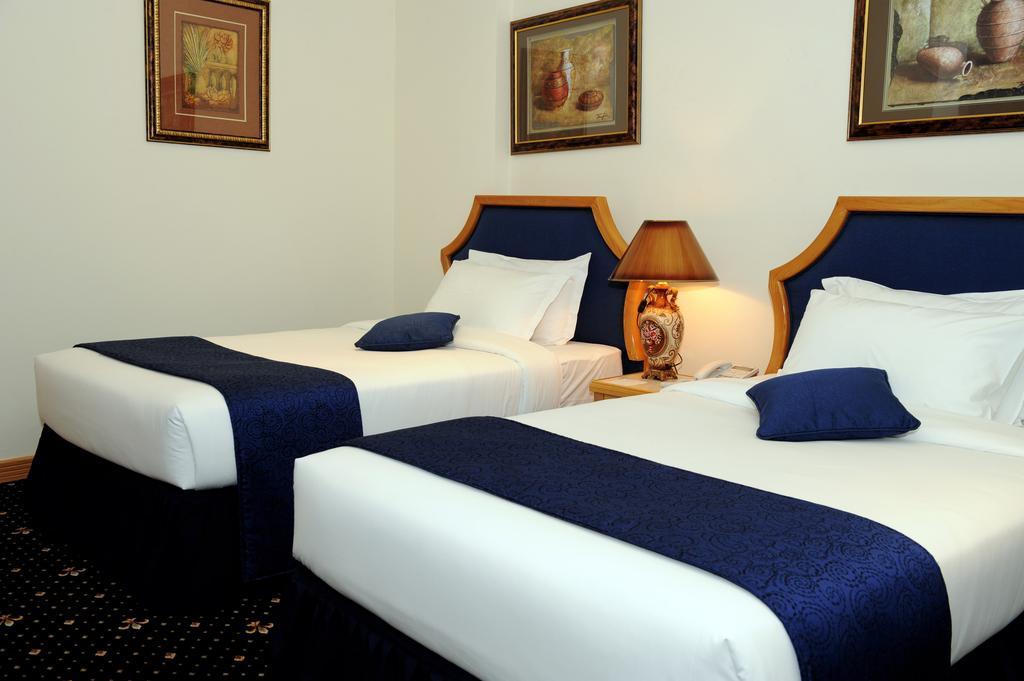 Cayam Hotel Doha Oda fotoğraf